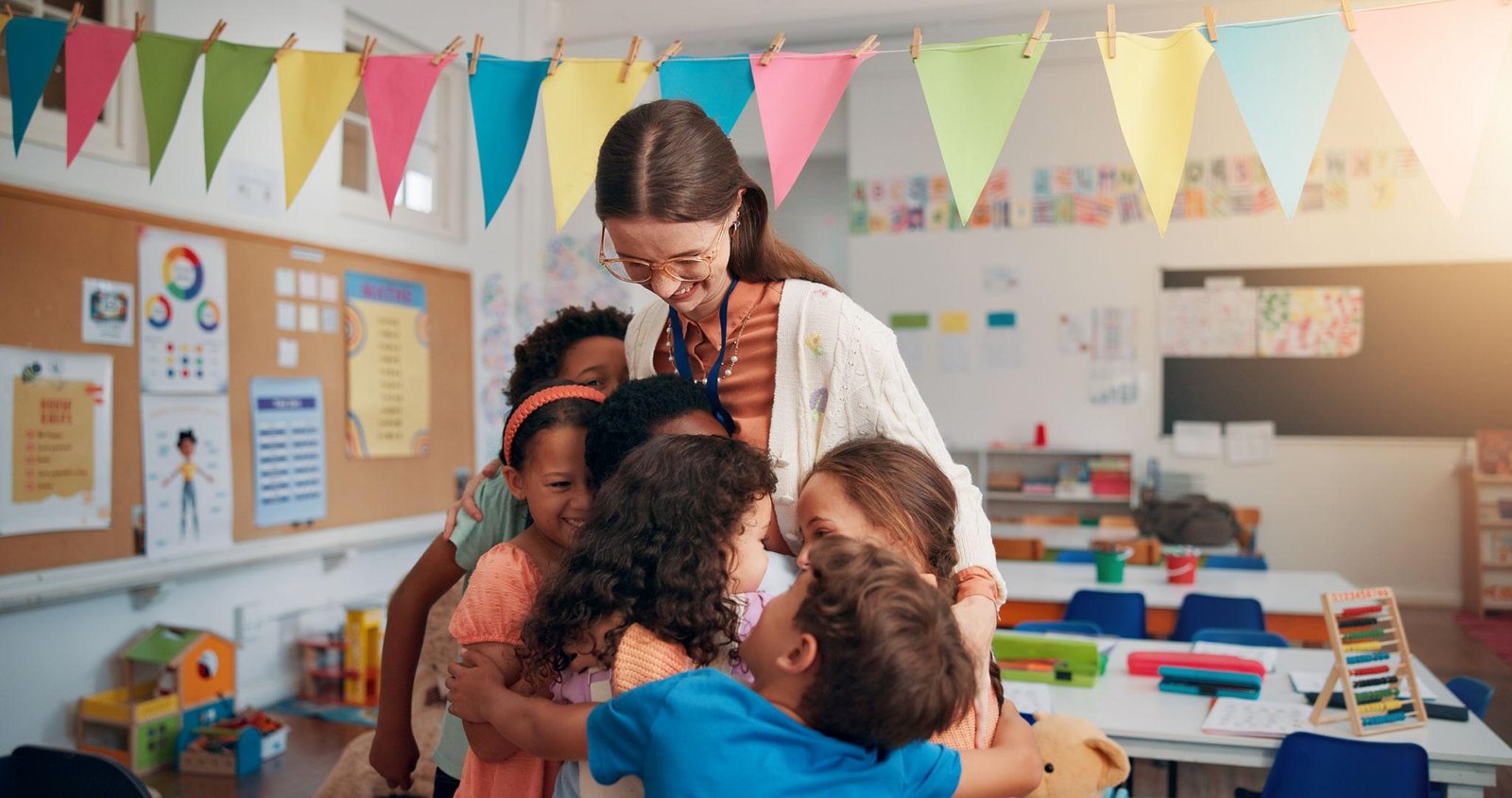 Loving teacher with young students